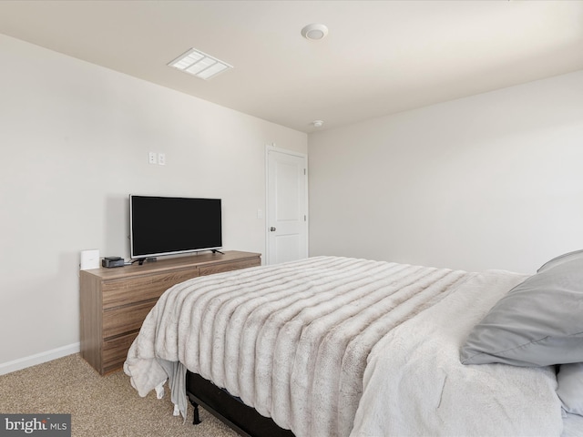 carpeted bedroom with baseboards