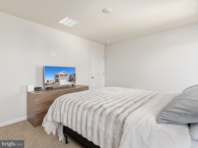 bedroom featuring carpet floors and baseboards