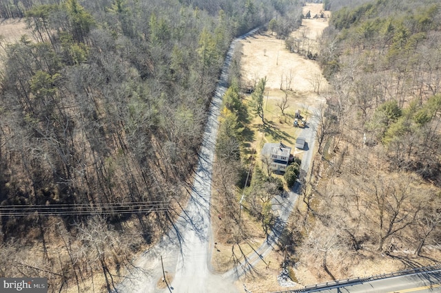 aerial view featuring a wooded view