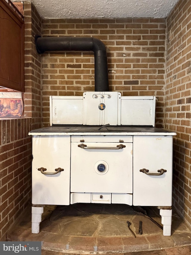 room details featuring dark countertops and a textured ceiling