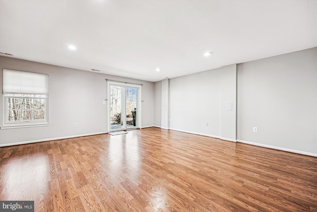 spare room featuring recessed lighting, baseboards, visible vents, and light wood finished floors