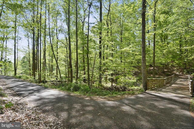 view of street featuring a wooded view