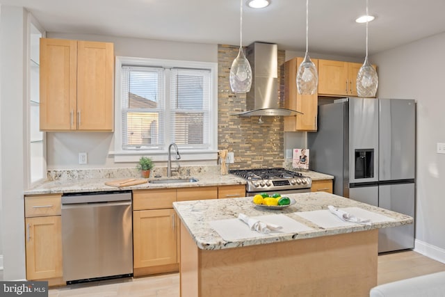 kitchen with stainless steel appliances, a sink, wall chimney exhaust hood, and light brown cabinetry