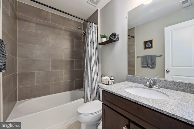 full bathroom featuring toilet, vanity, shower / bath combo with shower curtain, and visible vents