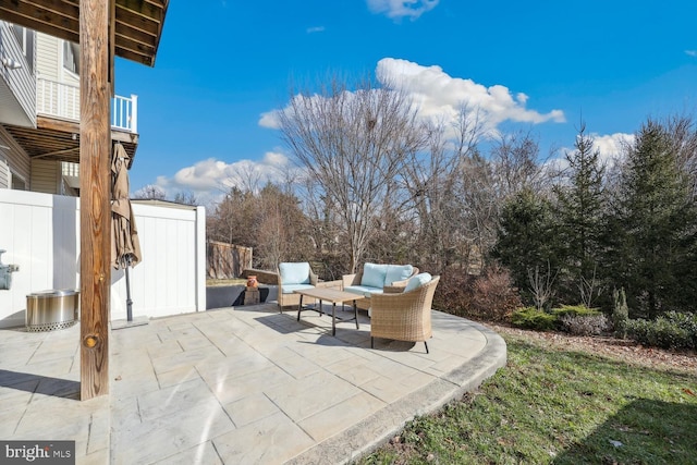 view of patio / terrace with fence and an outdoor living space