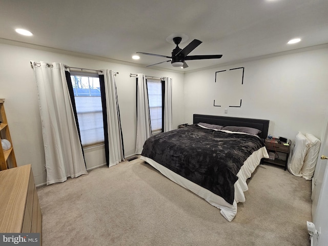 bedroom featuring light carpet, crown molding, a ceiling fan, and recessed lighting