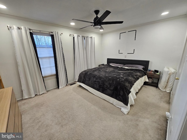 bedroom featuring crown molding, recessed lighting, a ceiling fan, and light colored carpet