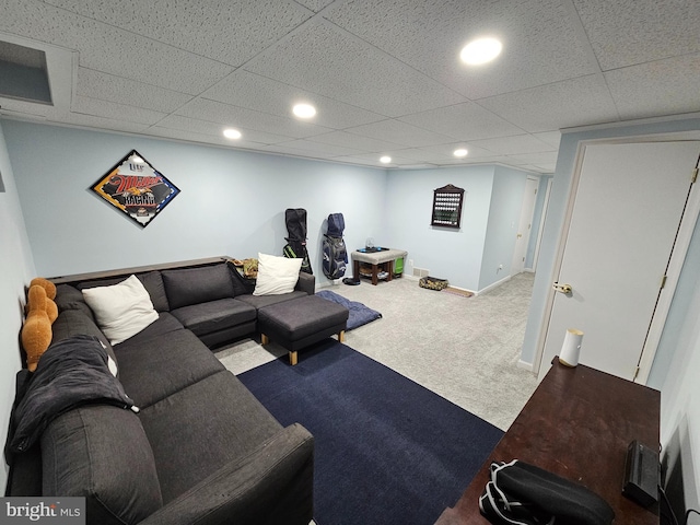 carpeted living area with recessed lighting, a drop ceiling, and baseboards