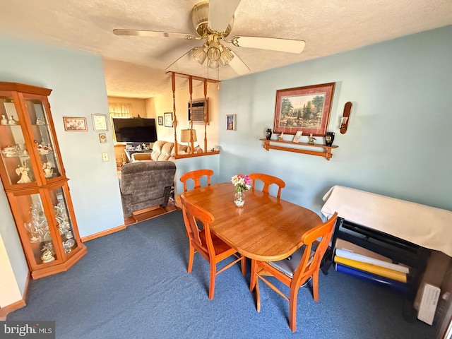 carpeted dining area featuring a ceiling fan, an AC wall unit, a textured ceiling, and baseboards