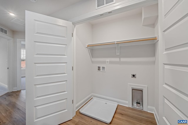 washroom featuring hookup for a washing machine, laundry area, visible vents, light wood-style floors, and electric dryer hookup