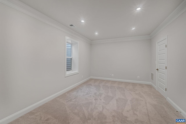 unfurnished room with light carpet, baseboards, visible vents, and ornamental molding