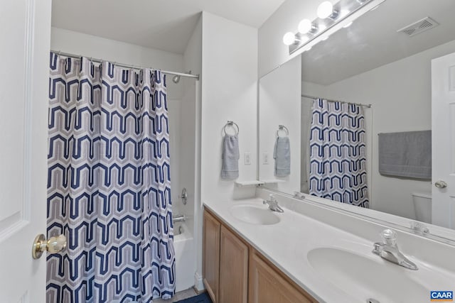 bathroom featuring visible vents, a sink, shower / bathtub combination with curtain, and toilet