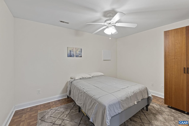 bedroom with visible vents, ceiling fan, and baseboards