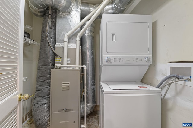 laundry area with stacked washer / dryer and laundry area