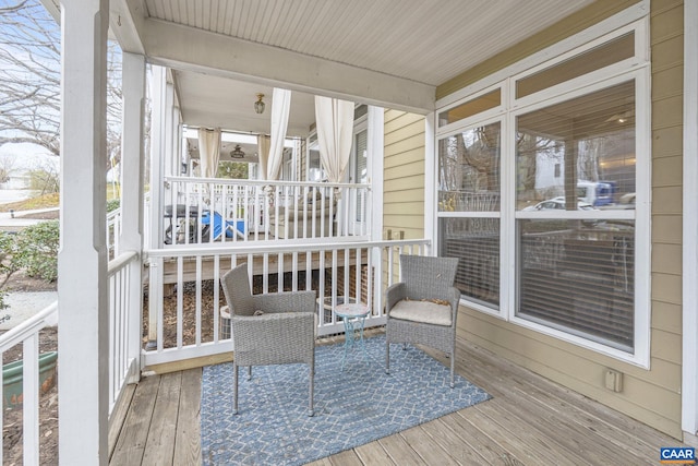 sunroom with beamed ceiling