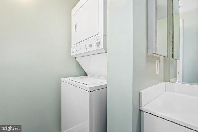 laundry area with laundry area and stacked washer and clothes dryer