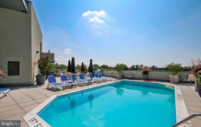 community pool featuring a patio area