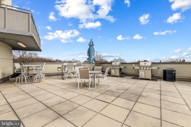 view of patio with grilling area and outdoor dining area