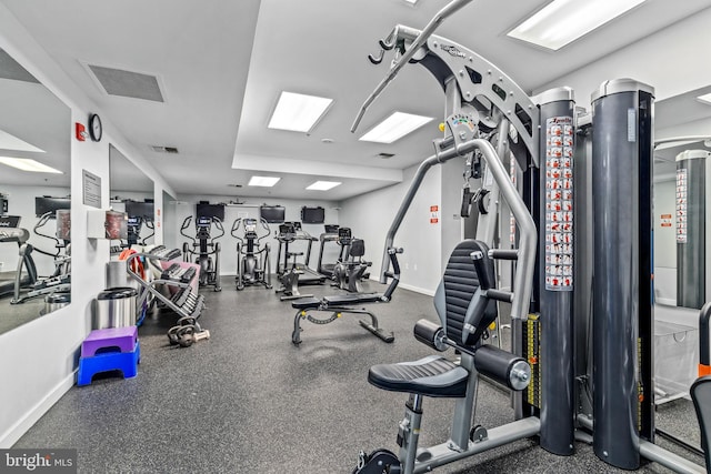 workout area with visible vents and baseboards