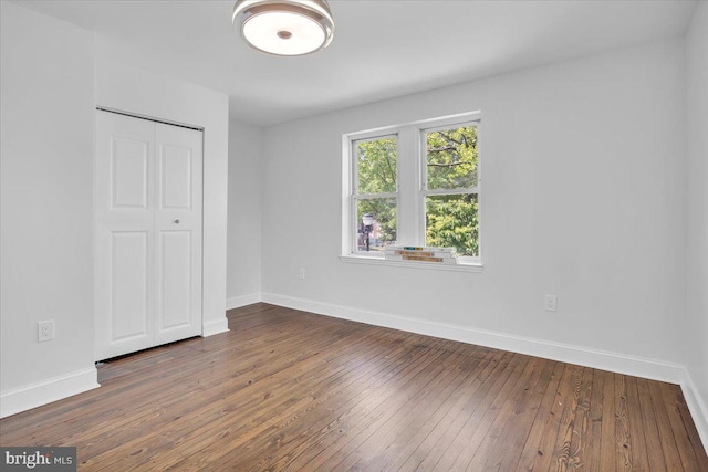 2782 Yorkship Rd, Camden, NJ 08104 - unfurnished bedroom with a closet, baseboards, and hardwood / wood-style floors