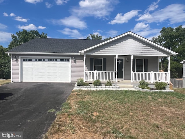 view of front of home with aphalt driveway, roof with shingles, a porch, an attached garage, and a front yard