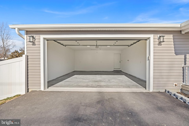 garage with fence