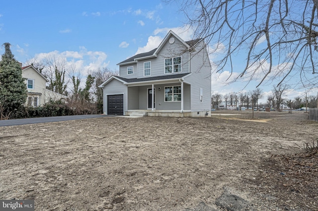 view of front of property featuring driveway and a porch