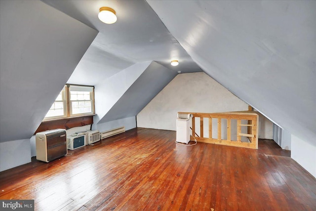 bonus room featuring lofted ceiling, dark wood-style floors, and a baseboard radiator