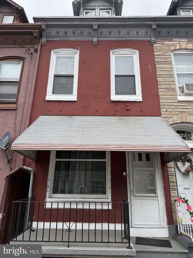 view of front of house with brick siding