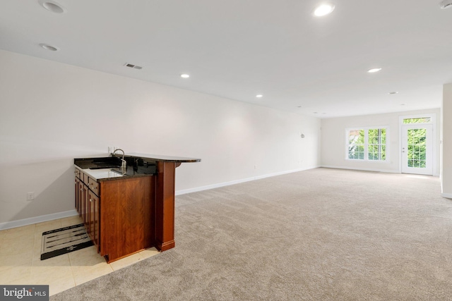 bar with recessed lighting, light colored carpet, a sink, visible vents, and baseboards