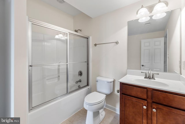 bathroom featuring bath / shower combo with glass door, visible vents, toilet, vanity, and tile patterned flooring