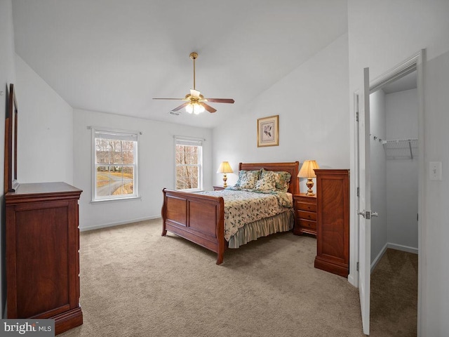 3110 Blackberry Ln, Prince Frederick, MD 20678 - bedroom featuring baseboards, ceiling fan, carpet, a walk in closet, and lofted ceiling
