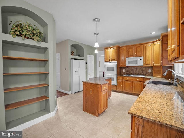 3110 Blackberry Ln, Prince Frederick, MD 20678 - kitchen featuring white appliances, a sink, light stone counters, and a kitchen island