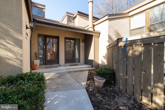 doorway to property with stucco siding