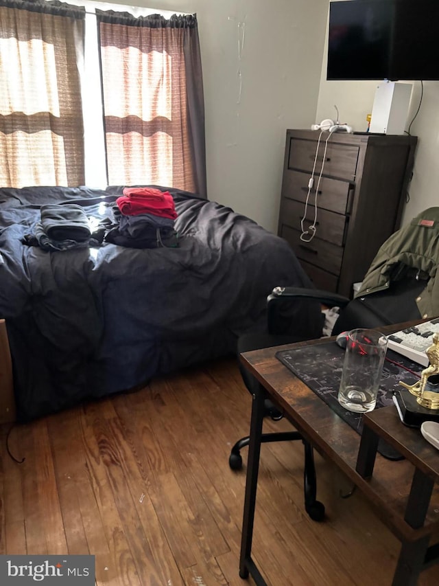 bedroom with wood finished floors