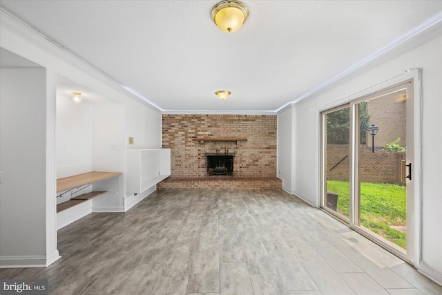 7349 Eldorado Ct, Mclean, VA 22102 - unfurnished living room featuring crown molding, a brick fireplace, wood finished floors, and baseboards