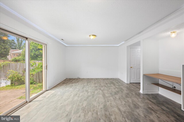 7349 Eldorado Ct, Mclean, VA 22102 - spare room featuring ornamental molding, wood finished floors, and baseboards