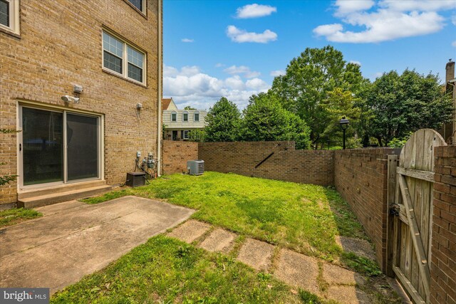 7349 Eldorado Ct, Mclean, VA 22102 - view of yard featuring central AC unit, a gate, and a patio