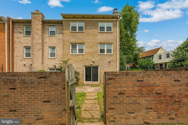 7349 Eldorado Ct, Mclean, VA 22102 - rear view of property featuring a chimney and brick siding