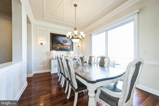 dining area with baseboards, dark wood finished floors, and crown molding