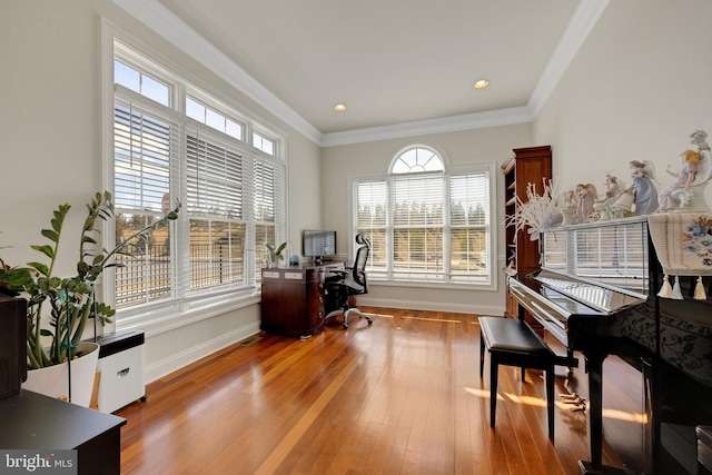 office featuring hardwood / wood-style flooring, baseboards, crown molding, and recessed lighting