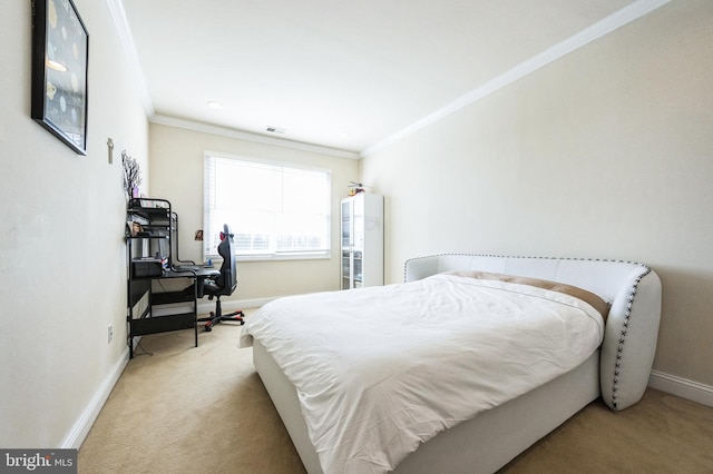 carpeted bedroom with visible vents, baseboards, and crown molding