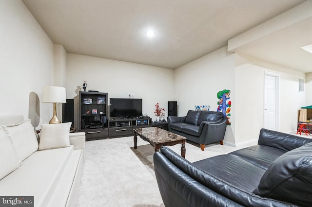 carpeted living area featuring baseboards and visible vents