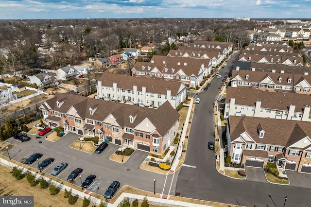 birds eye view of property with a residential view