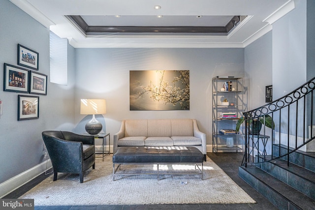 living area featuring stairs, baseboards, a raised ceiling, and crown molding