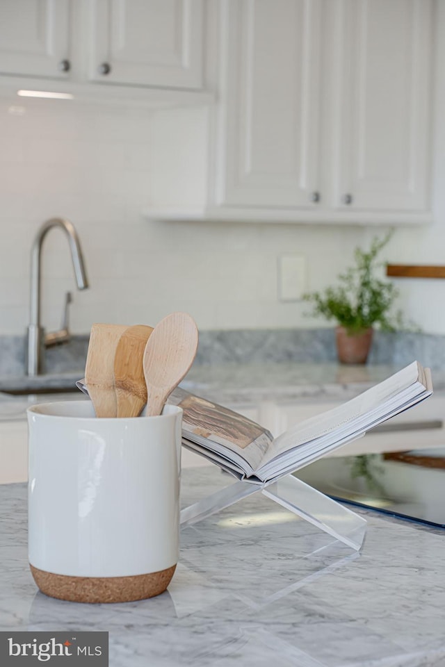 details with light countertops and white cabinetry