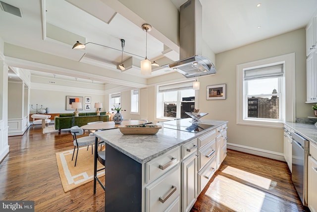 kitchen featuring a healthy amount of sunlight, island range hood, black electric stovetop, and wood finished floors