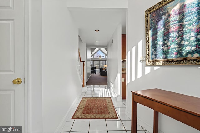 hall with recessed lighting, baseboards, stairway, and light tile patterned flooring