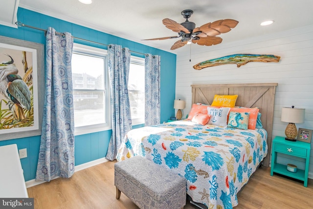 bedroom with light wood-type flooring and ceiling fan