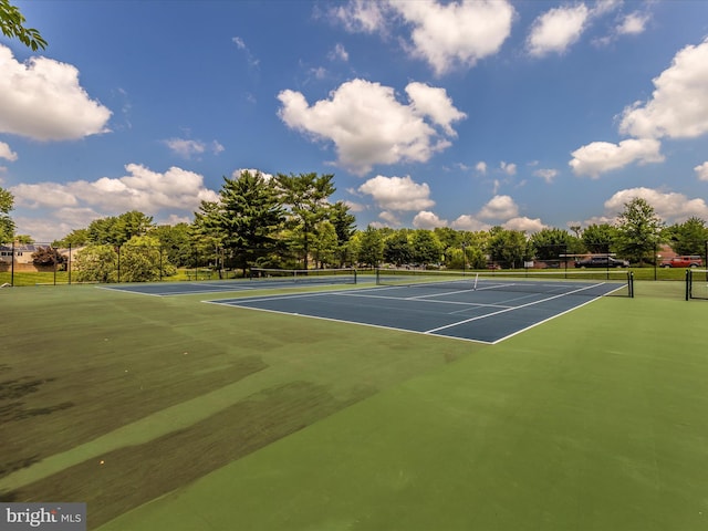 view of sport court with fence